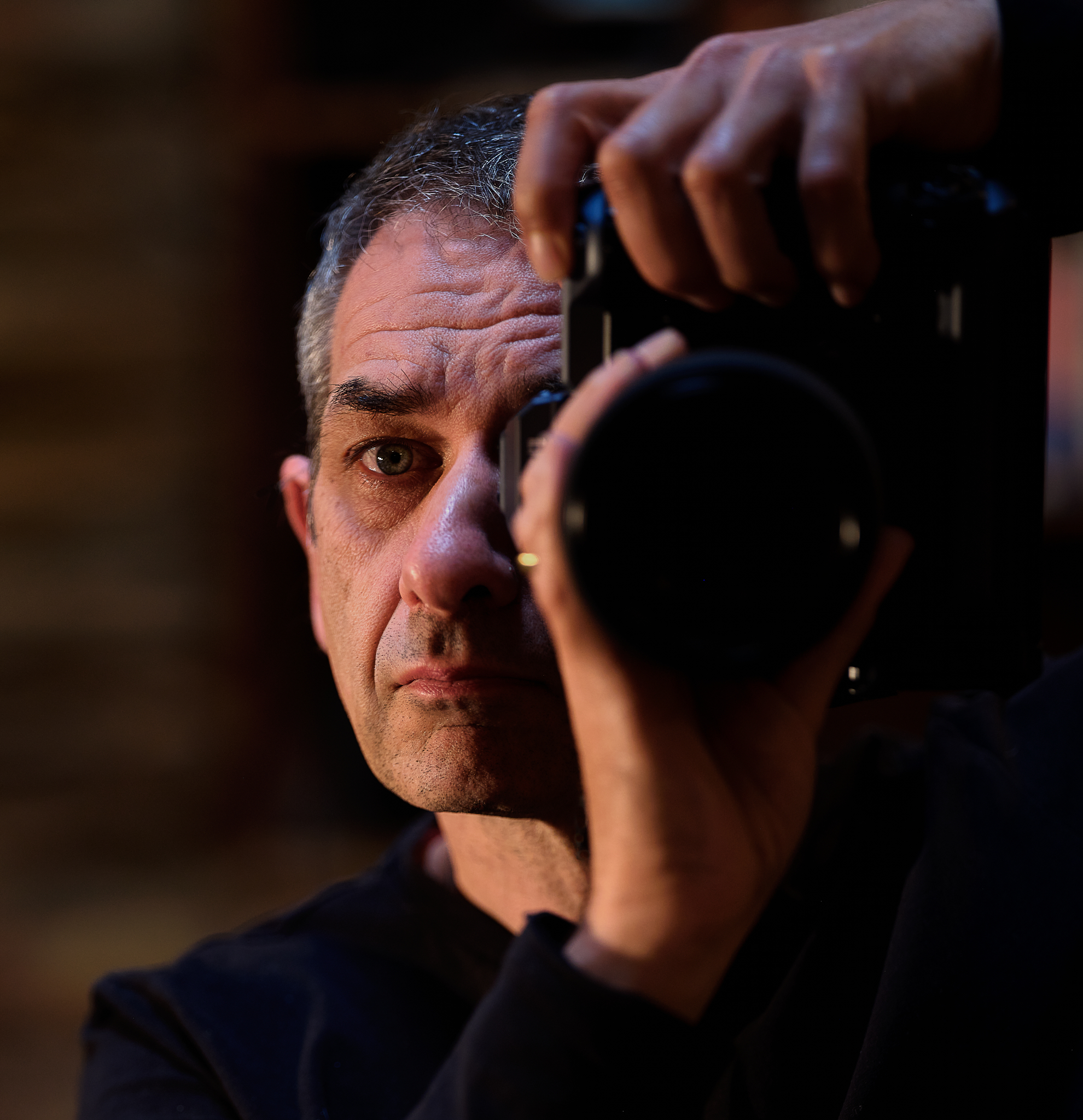 Geoff Parker holding a camera